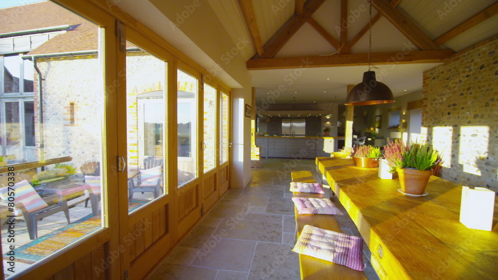 Interior view of dining area in stylish country home with lots of natural light Interior view of dining area in stylish country home with lots of natural light