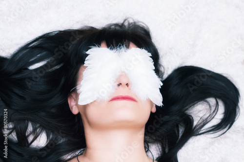 Woman relaxing with eye mask