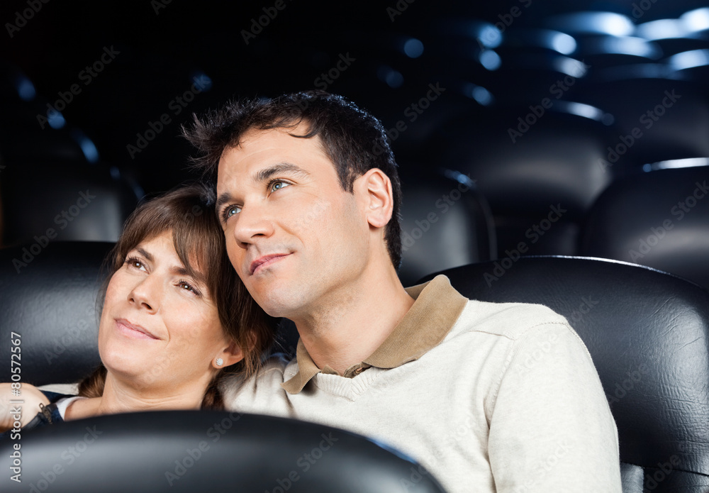Naklejka premium Loving Couple Watching Movie In Theater
