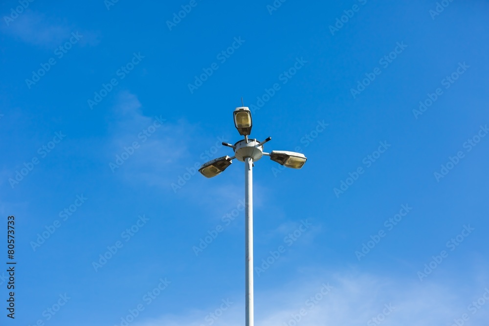 Street lamp on blue sky background