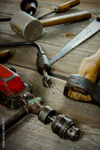 Various tools on a wooden background.