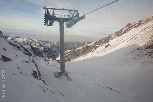 The cable car in the snowy mountains Chimbulak © frizzyfoto