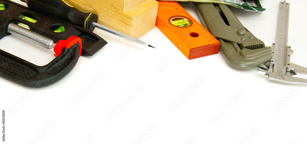 Many working tools - caliper, ruler and others on white
