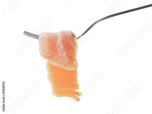 rolled curred salmon on fork isolated photo