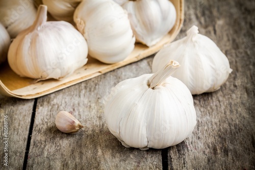 organic garlic bulbs on a wooden background