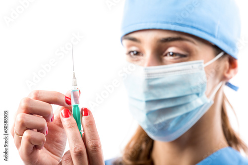 A nurse with syringe in her hand.