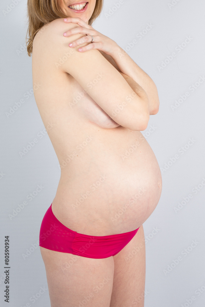 Pregnant Woman holding her hands on her stomach