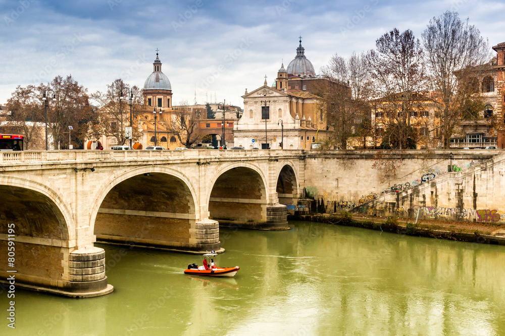 Bridge over the Tiber river in the center of Rome