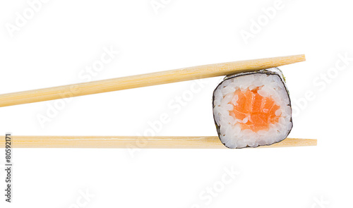 Tableau sur toile Sushi roll with chopsticks isolated on white