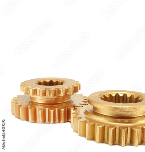 Copper and gold gear isolated on white background photo