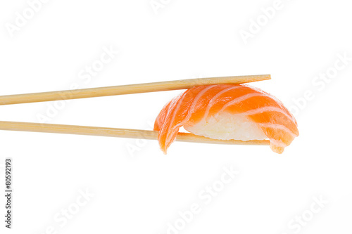 Sushi nigiri with chopsticks isolated on white