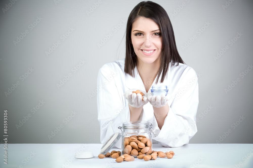 Dermatologist doctor presenting creme.Organic cosmetics. Dermatologist doctor presenting creme.Organic cosmetics.