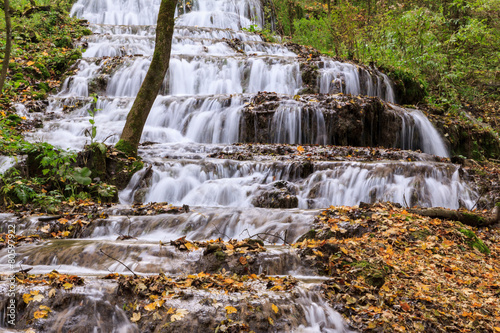 Mountain river in forest, autumn landscape
