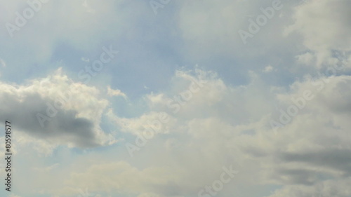 Timelapse floating clouds on a blue sky over the city 4K