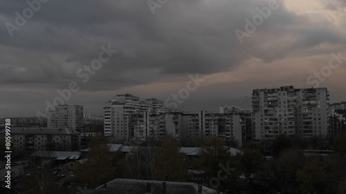 Timelapse floating clouds on a blue sky over the city