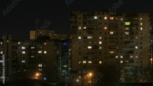 Night city. The light in the Windows of tall buildings