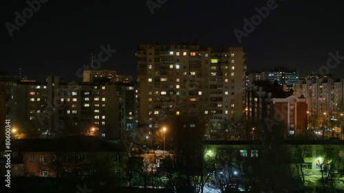 Night city. The light in the Windows of tall buildings