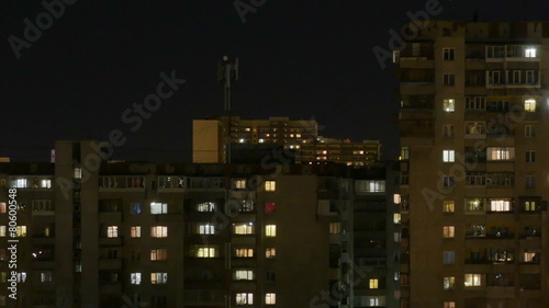 Night city. The light in the Windows of tall buildings