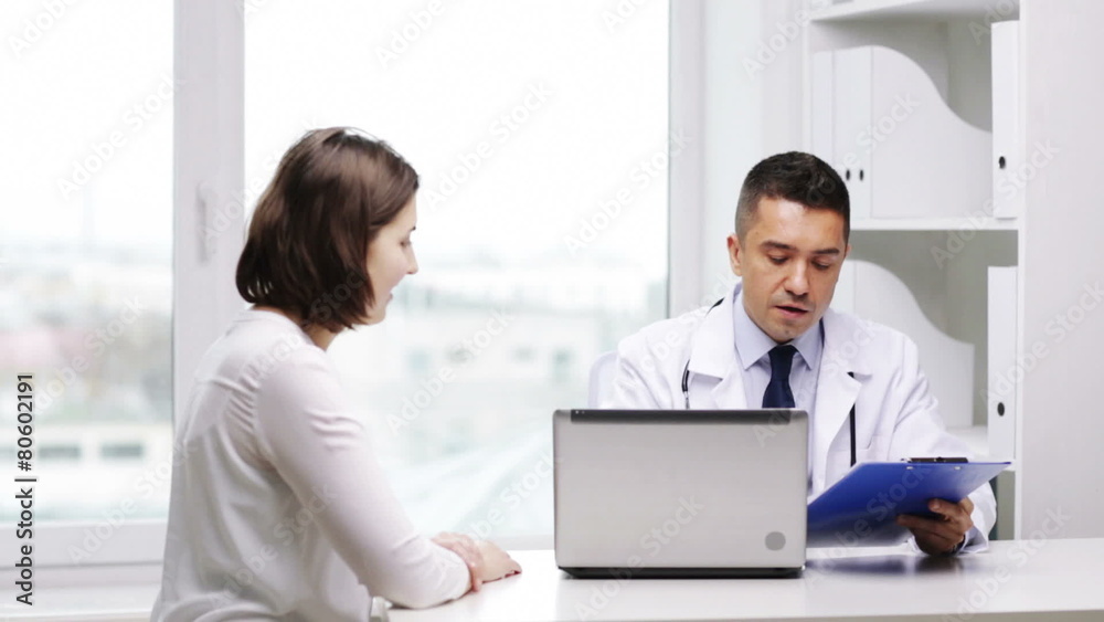 smiling doctor and young woman meeting at hospital smiling doctor and young woman meeting at hospital