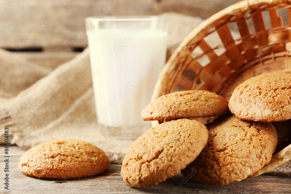 Tasty cookies and glass of milk on rustic wooden background Tasty cookies and glass of milk on rustic wooden background