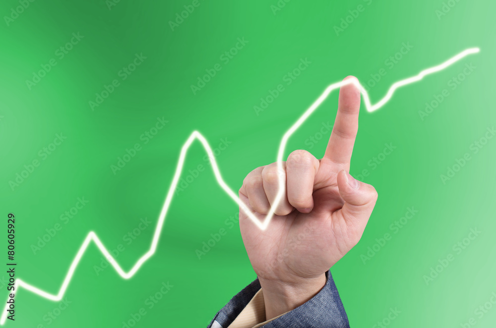 Hand of Asian business man pointing a line graph on a virtual to Hand of Asian business man pointing a line graph on a virtual to
