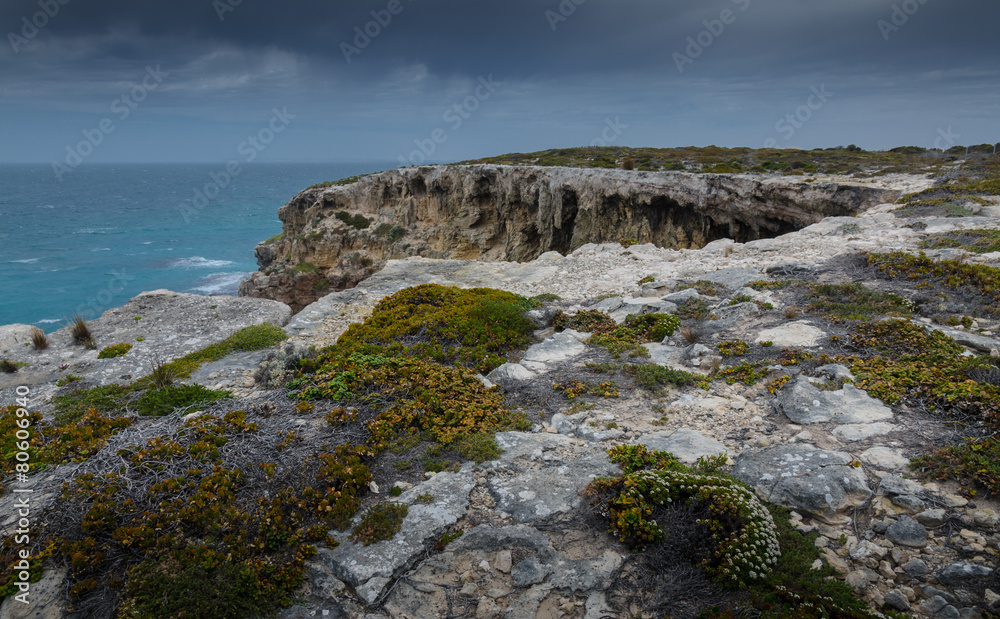 Stormy seascape with eroded cliffs