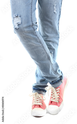 Human legs in jeans and shoes isolated on white © Africa Studio