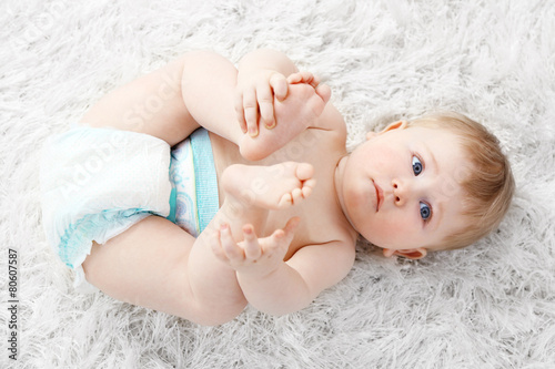Cute baby boy on carpet, on...
