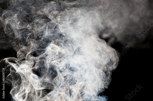 The abstract figure of the smoke on a black background © schankz