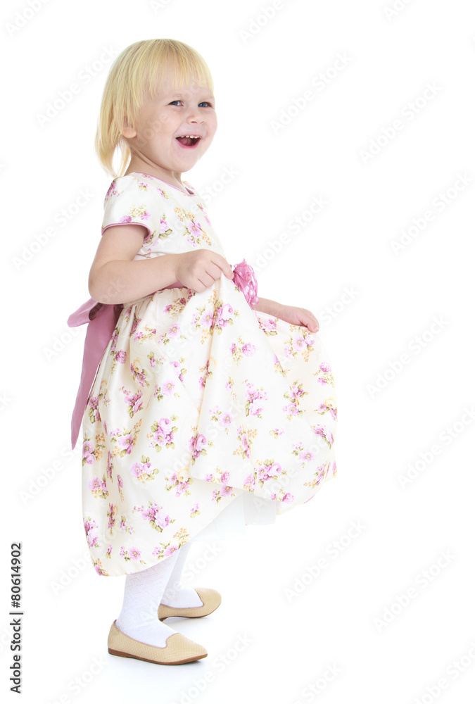 Little happy girl in a bright dress Little happy girl in a bright dress