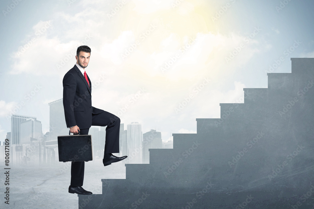 Businessman climbing up a concrete staircase concept Businessman climbing up a concrete staircase concept