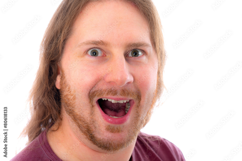 young man with long hair is laughing young man with long hair is laughing