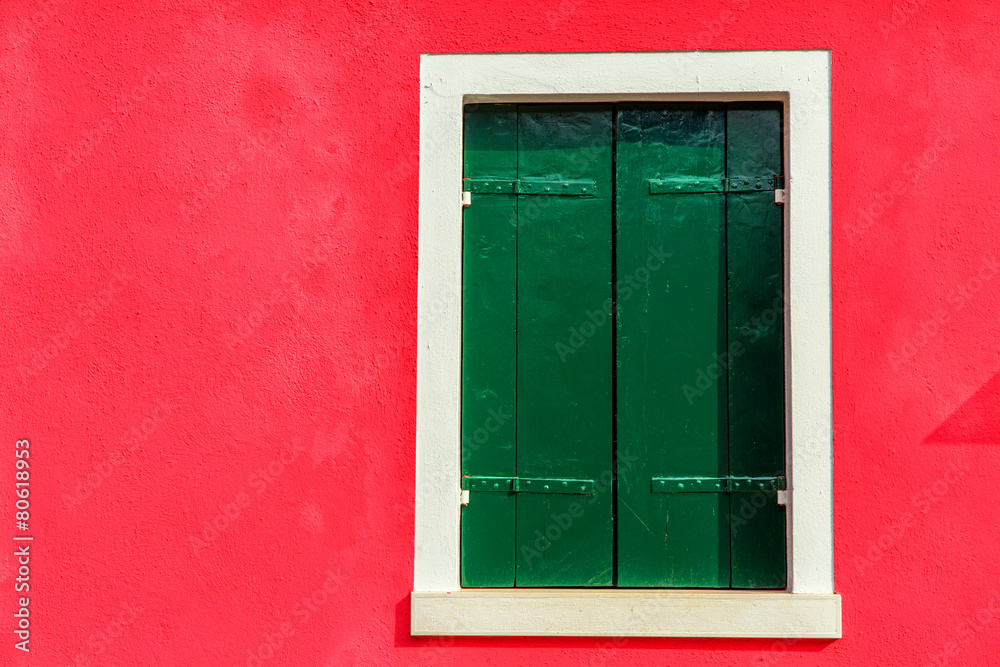 Colorful window of a house on the Venetian island of Burano Colorful window of a house on the Venetian island of Burano