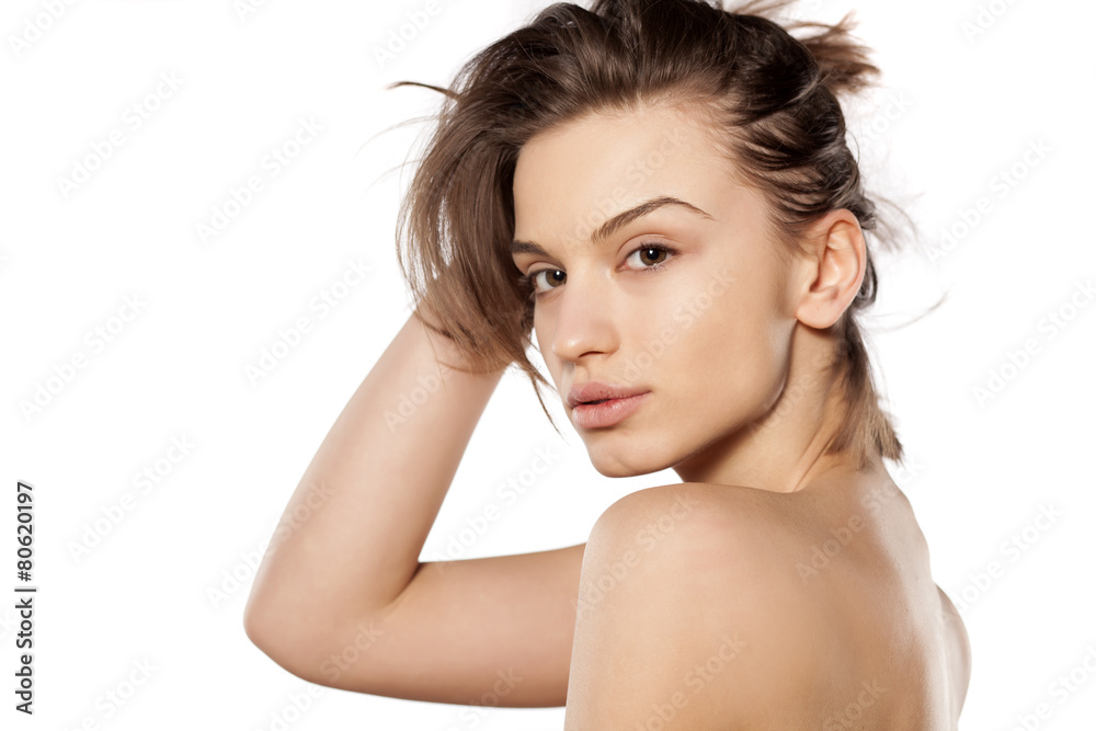 young beautiful woman without make-up on a white background young beautiful woman without make-up on a white background