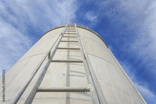 High steel ladder on big water tank