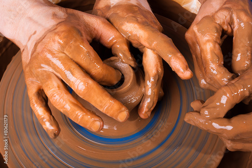 Potter teaches to work on pottery wheel