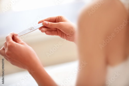 Woman Holding Pregnancy Test photo