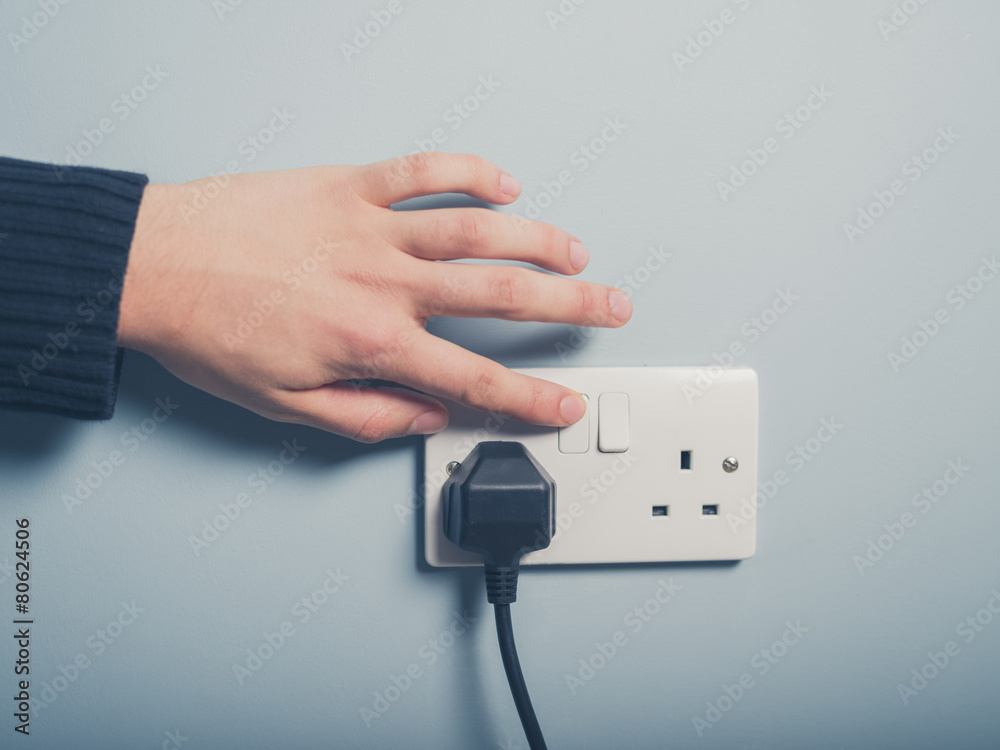 © LoloStock - Male hand pushing switch © LoloStock - Male hand pushing switch