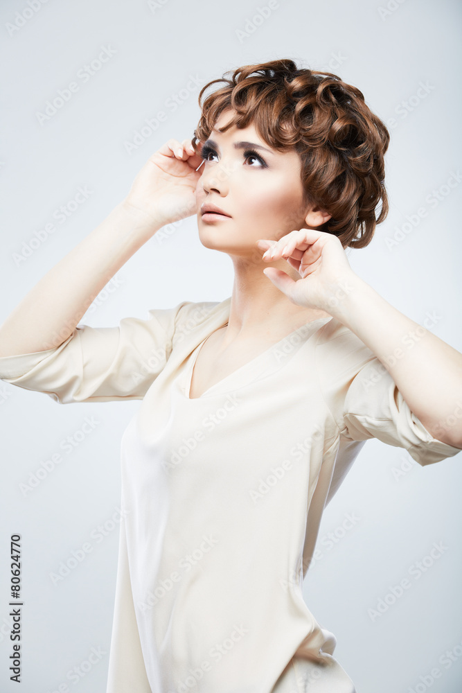 Fashion model woman posing in studio. Young model with short ha Fashion model woman posing in studio. Young model with short ha
