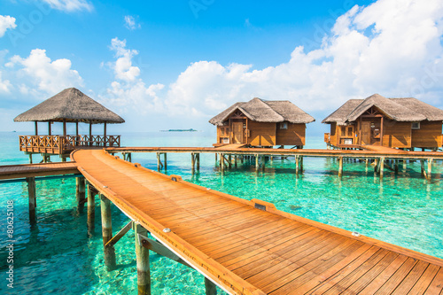 Over water bungalows with steps into amazing green lagoon