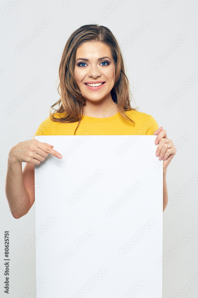 smiling woman pointing finger on white blank business card. smiling woman pointing finger on white blank business card.