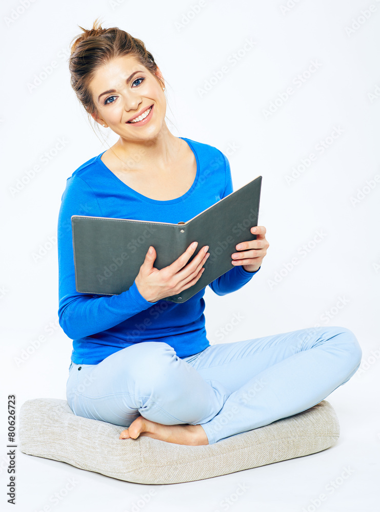 Girl student sitting with open book. Girl student sitting with open book.