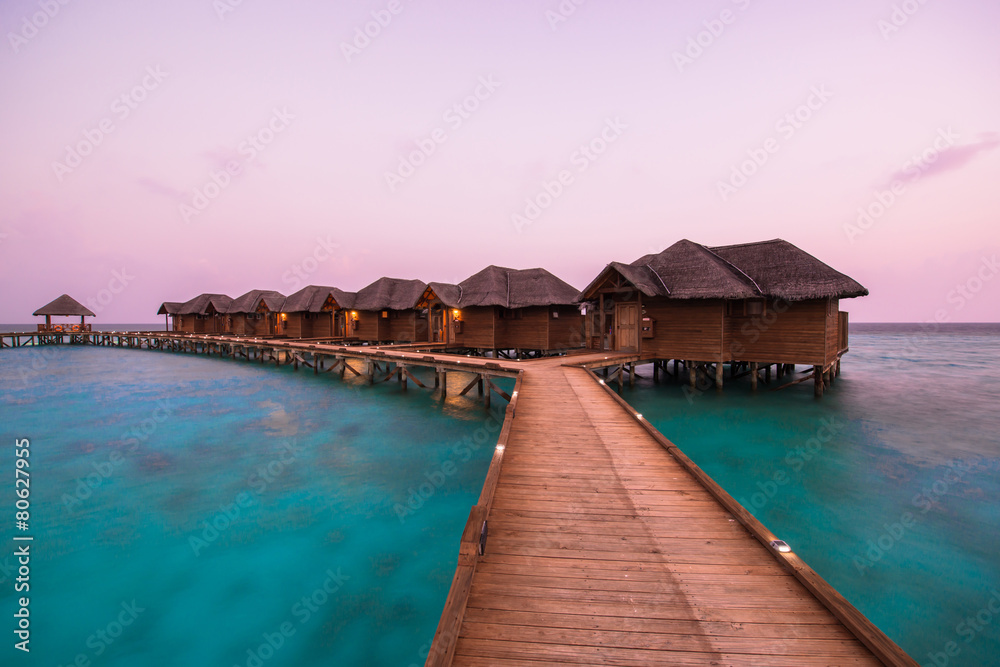 Over water bungalows with steps into amazing green lagoon