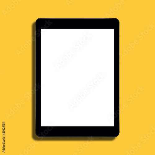 Fototapeta Naklejka Na Ścianę i Meble -  Tablet computer on yellow background