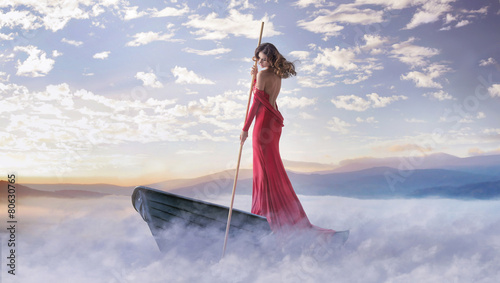 Photos Alone smart woman paddling in the clouds