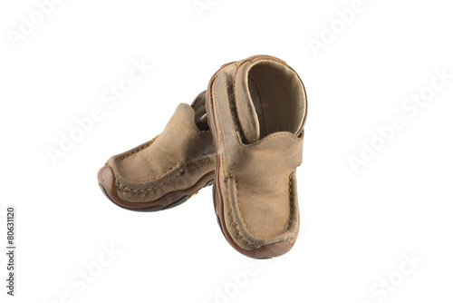 Children's shoes from skin on white background