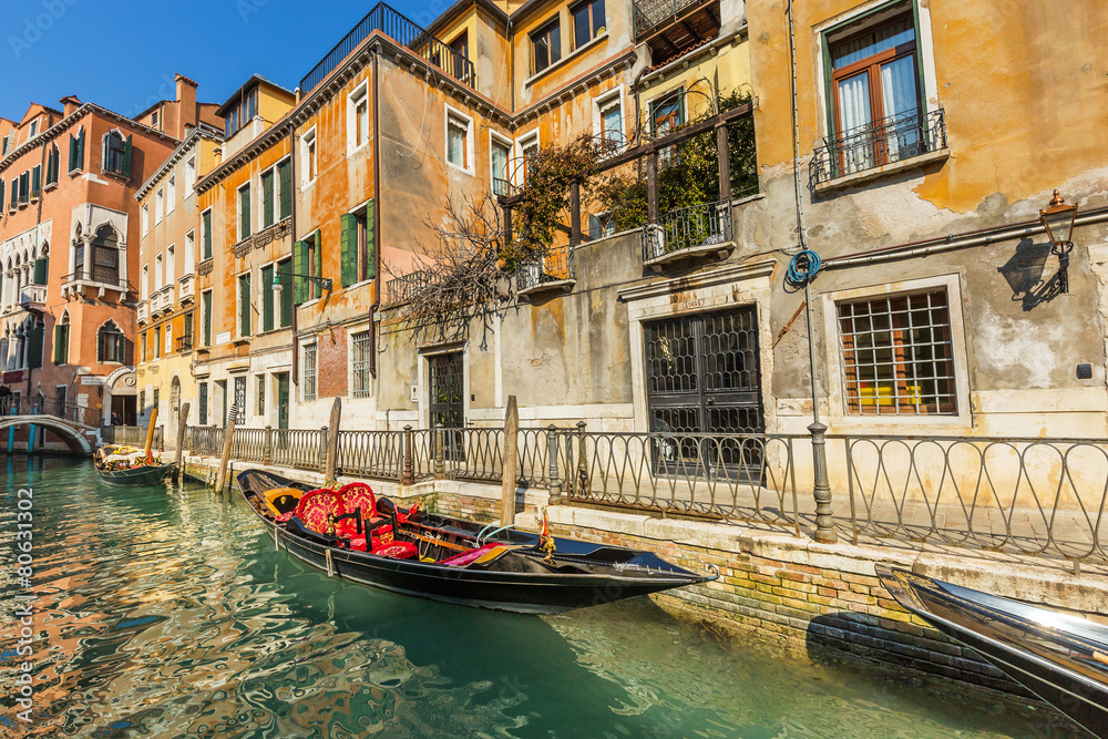 Lovely canal with gondola in Venice