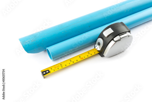 Measuring Tape and PVC pipe on white background.