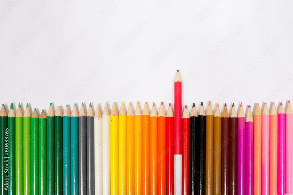 Red pencil standing out from others Red pencil standing out from others