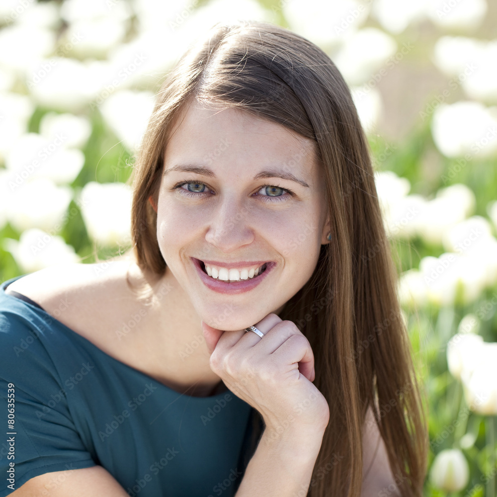 Beautiful young woman with tulips field Beautiful young woman with tulips field